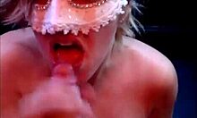 Homemade video of a big cock exploding on masked milf's tits